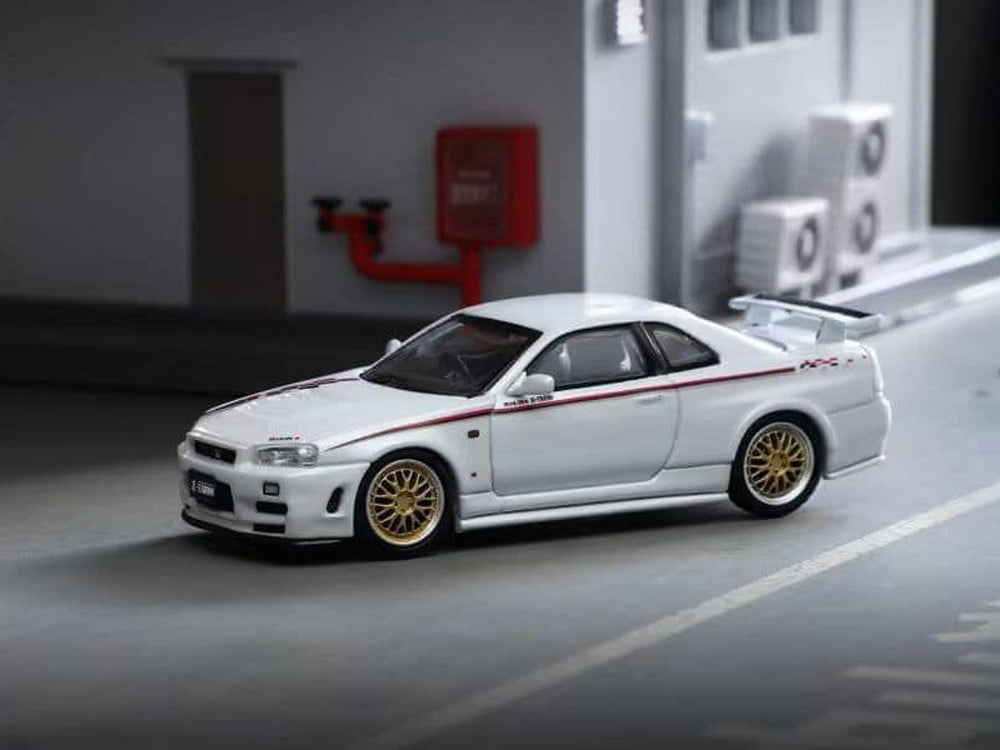 Stance Hunters 1/64 Nissan Skyline GT-R R34 Z Tune Nismo Livery with Gold BBS Wheels Pearl White - Diecast Toyz Australia